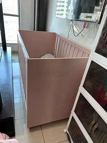 Light pink wooden baby crib - sturdy and gently used