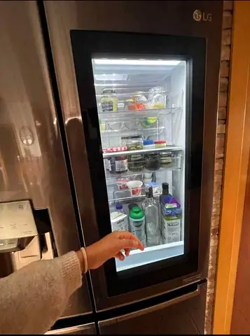 L.G Door in Door Instaview Four Door Fridge Freezer With Water Dispenser Barely Use Same As New