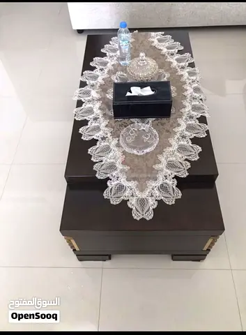 Dark Wood Nesting Coffee Tables with Decorative Lace Runner