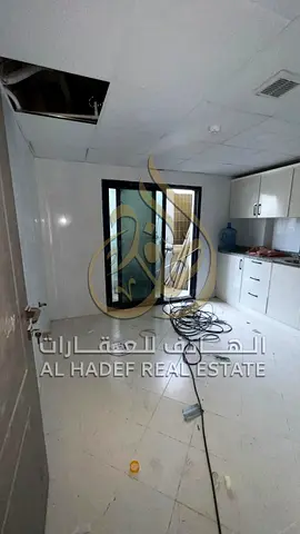 Two-bedroom apartment with balcony and free maintenance for bachelor sharing in Al Majaz 1 near Dub