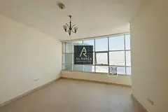 For annual rent in Ajman, in the Orient Towers: rooms, a living room, and 2 bathrooms; spacious area