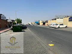 Freehold industrial land for sale in Al Sajaa area, walled, with all services, ready and currently l