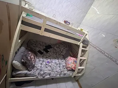 White wooden bunk bed (single over single) in used condition on urgent sale