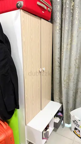 Compact two-door wardrobe with bottom storage shelf