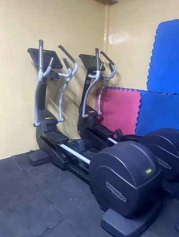 Pair of Technogym Elliptical Cross Trainers - Good Working Condition