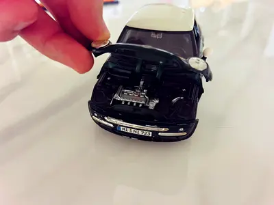 Die-cast Mini Cooper model car with opening hood
