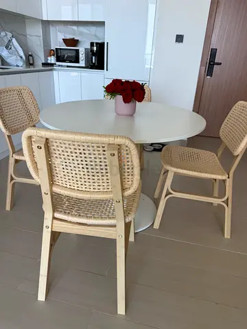 White Round Dining Table with 4 Rattan-style Chairs