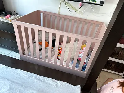 Light pink wooden baby crib - sturdy and gently used