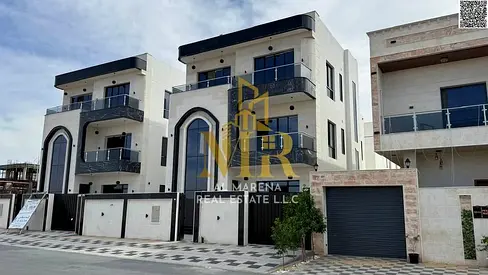 Two-story villa with a rooftop terrace, priced at a special price including registration and ownership fees, in one of Ajman's most prestigious areas.