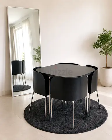 Compact black dining table with 4 matching chairs