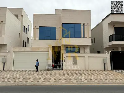 Two-story villa in Al Yasmin, 5 bedrooms, at a special price including registration fees and air conditioning. Located in one of Ajman's most prestigi