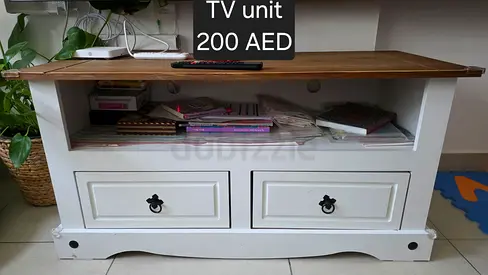 White wooden TV unit with drawers and shelf — 200 AED
