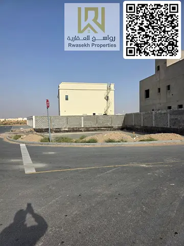 Corner Residential land for sale in Al Amerah Ajman in a prime strategic location opposite Azha com