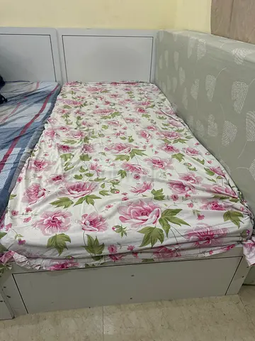 White single bed frame with mattress