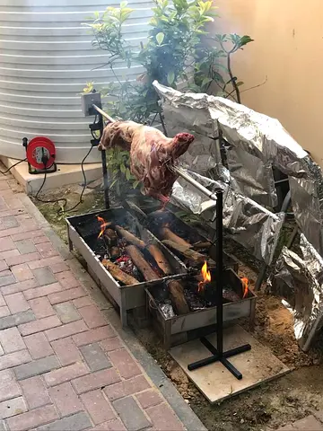Rotisserie with electric rotor for full lamb