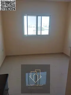 A distinctive studio in Al Rawda with a semi-separate kitchen