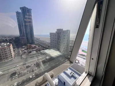 Brand new 2-bedroom apartment for annual rent in Ajman Corniche, first row on the beach with direct sea views and luxurious features.