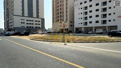 Corner residential/commercial plot for sale in Al Jurf Industrial Area 1, Ajman. Area: 11,000 sq ft. Permit for ground floor + 8. Prime location suita
