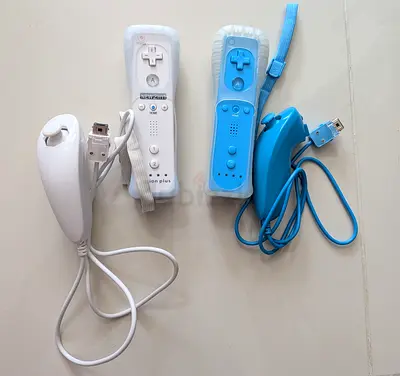 One set of Nintendo Wii Remote Controllers with Nunchuks for only 50 aed