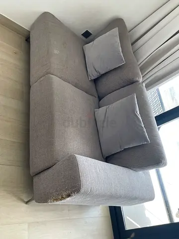 2-seater grey fabric sofa with cushions — used
