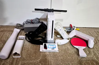 Nintendo Wii with all cables, 2 controllers ,accessories and more than 50 games
