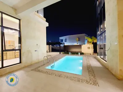 luxurious 6BR villa with pool and rooftop , including electricity, water and AC. in Al Yasmin. Freehold . Bank financing .