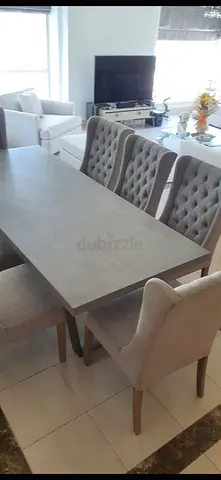 8-Seater Grey Dining Table with Upholstered Tufted Chairs - Good Condition