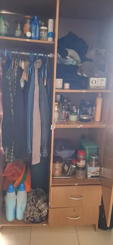 Used wooden wardrobe with hanging space and shelves - good condition