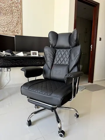 Black ergonomic office chair with headrest and footrest (good condition)