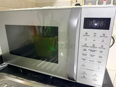 Used countertop microwave oven - silver, working condition
