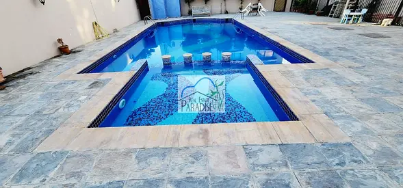 away from fly zone 3 bedrooms all master, tv lounge, pvt back yrd /fitted kitchen/shared swimming pool 2 covered parking/available for rent in mirdif