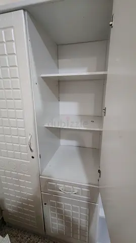 White freestanding wardrobe / storage cabinet with shelves and drawer