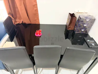 Black Glass Dining Table with  5 black Chairs - Good Condition