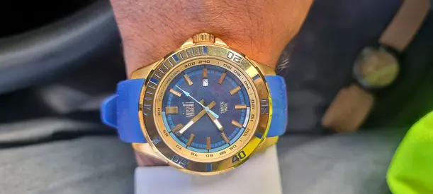 Gold-tone mens wristwatch with blue dial and blue silicone strap