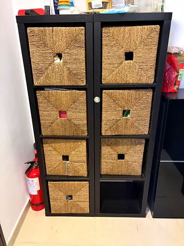 2x IKEA KALLAX storage column with a few baskets