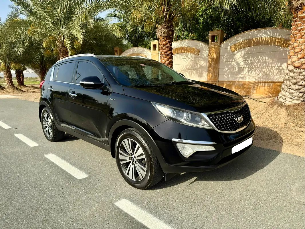Kia Sportage 2014 — photo 1 of 17