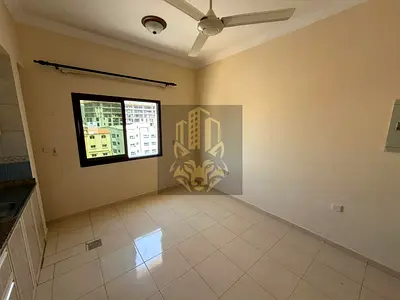 Apartment with one bedroom living room bathroom and two balconies with central AC in Al Hamidiyah behind the Traffic Department near Ajman University