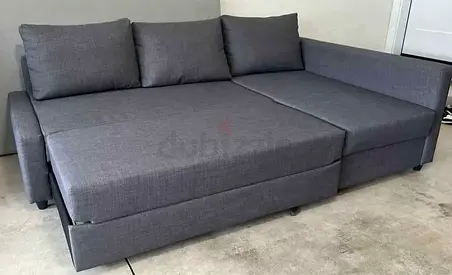 Gray L-shaped Sofa Bed with Storage — Good Condition