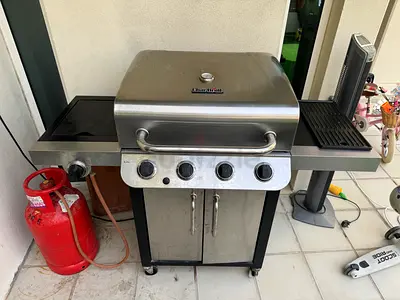 Used stainless steel 4-burner gas BBQ grill