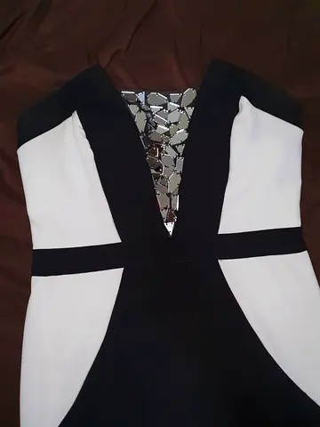 Black and white sleeveless evening dress with mirrored V-neck detail