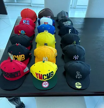Collection of 18 Mixed Baseball Caps (NY, LA, YMCMB, Assorted Logos) - Brand new