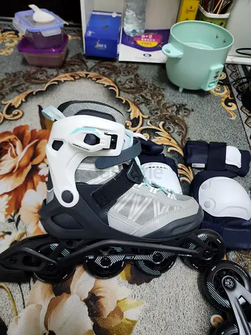 Adjustable Inline Roller Skates with Protective Pads - Light Green/Grey, Good Condition