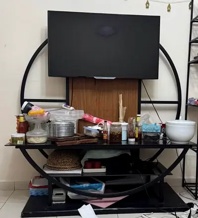 Black circular TV stand / entertainment center (metal  wood) - used