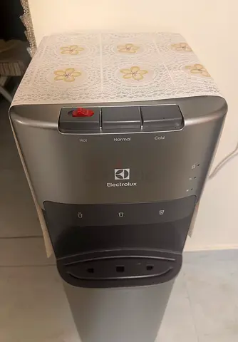 Electrolux Standing Water Dispenser (Hot/Cold/Normal) - Bottomload, along with water bottle stand