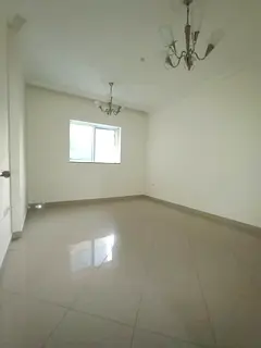 Built-in wardrobes + central AC + free gym, pool &amp; kids area, 1BR + hall for rent in Al Taawun, 