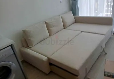 Beige L-Shaped Sofa Bed with Storage - Good Condition