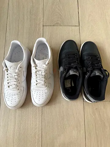 Pair of Nike Sneakers — Black and White, Unisex Casual Shoes (Used)