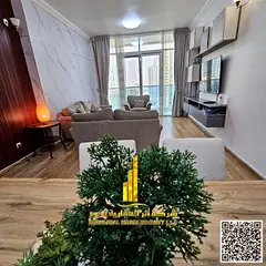 Luxurious two-bedroom apartment with a gym and a swimming pool, fully furnished for monthly rent in