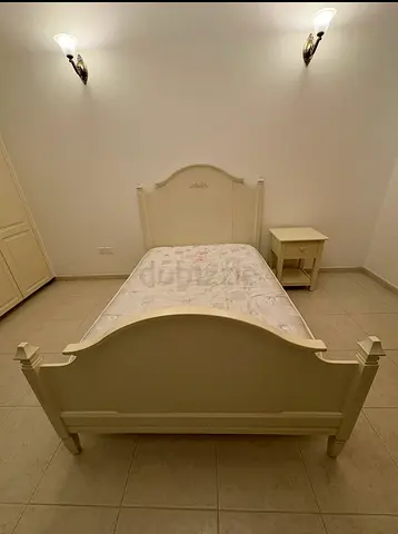 Pottery Barn - single white wooden bed frame with mattress, bedside table and book shelf