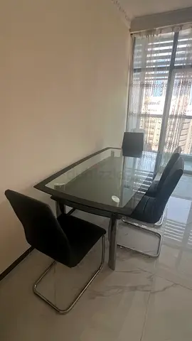 Glass Top Dining Table with 6 Black Chairs - Good Condition